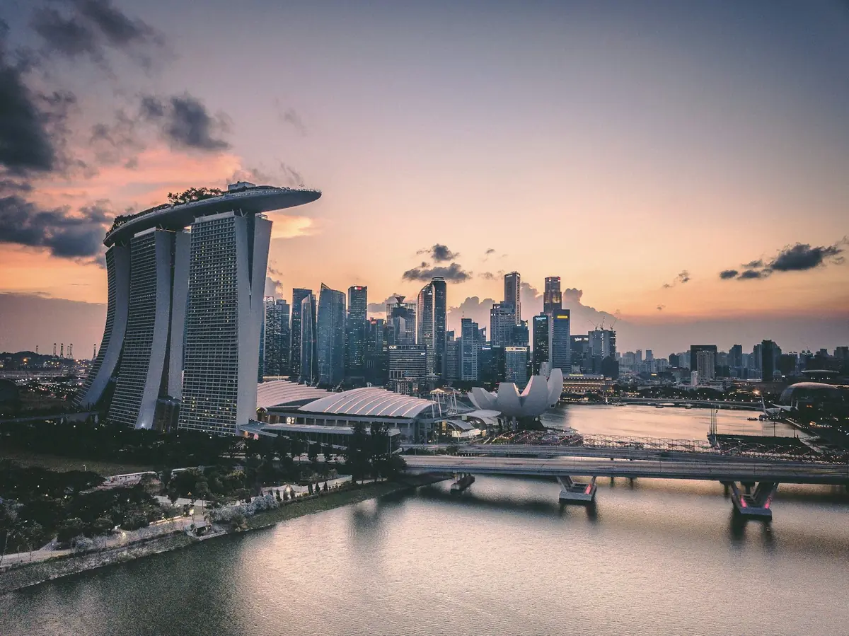 Singapore's Marina Bay skyline at dusk, seen across the water